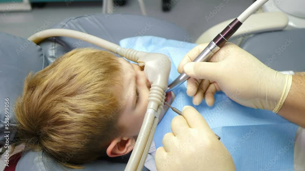 Nitrous oxide in dental clinic while treating young patients with milk