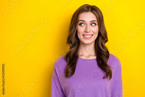 Portrait photo of young toothy beaming smiling woman brown wavy hairdo wear purple pullover look mockup promo isolated on yellow color background