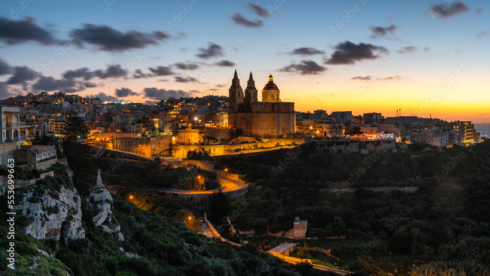 Il-Mellieha, Malta - Beautiful panoramic skyline view of Mellieha town after sunset with Paris Church