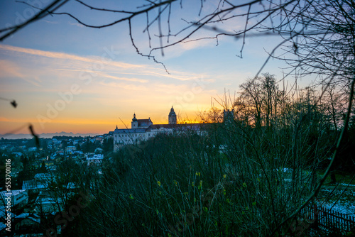 city view of enns, upper austria with clocktower and castle ennsegg in the evning light