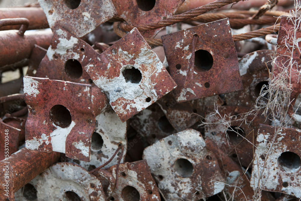 Rusty construction scaffolding stacked unused. Rusty construction scaffolding stacked unused.
