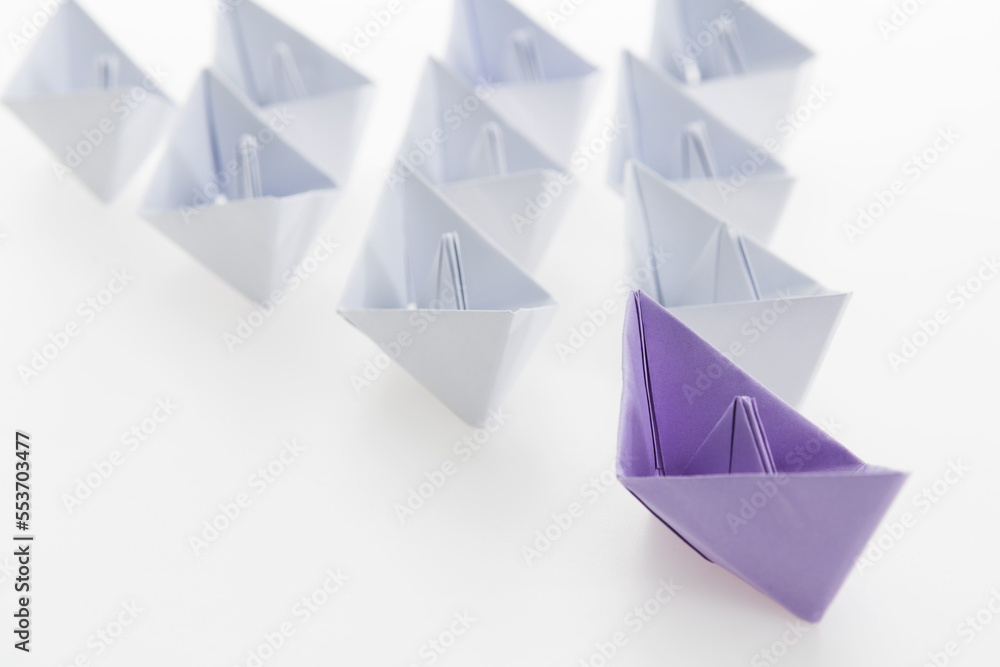The purple origami boat is leader The purple origami boat is leader