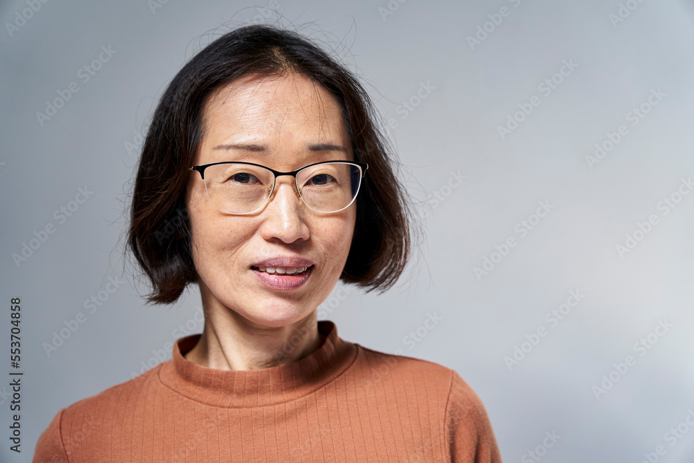 Mature Asian American woman looking at the camera Mature Asian American woman looking at the camera