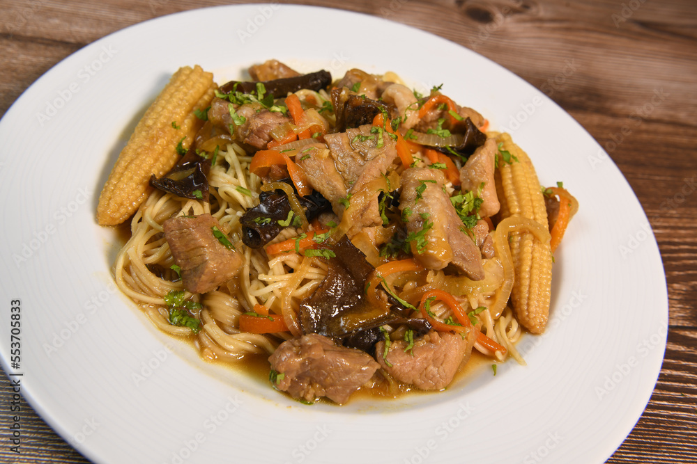 Recipe for wok-cooked pork loin with black mushroom and chinese noodle, corn on the cob, carrot, caramel sauce, soy, nuoc mam, ginger, High quality photo Recipe for wok-cooked pork loin with black mushroom and chinese noodle, corn on the cob, carrot, caramel sauce, soy, nuoc mam, ginger, High quality photo