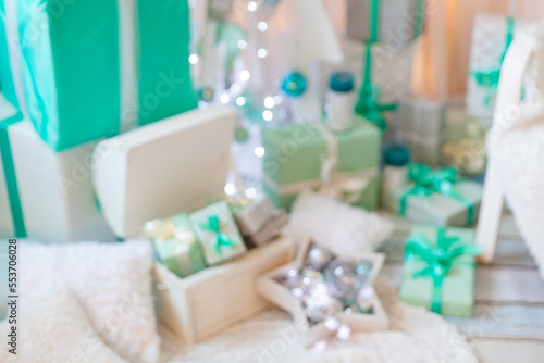 Blur Christmas scene with stylish mint studio Christmas interior © Olga Gorchichko