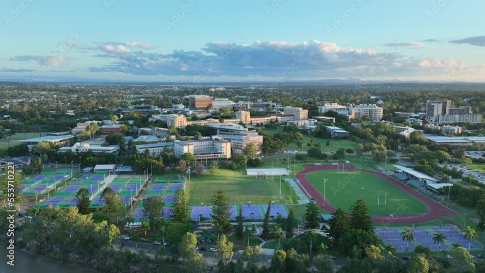 Drone shot of University of Queensland UQ St Lucia, Shot During Sunset, with Campus Buildings, Sports Fields, and Brisbane River in shot. Brisbane University 4K Drone shot of University of Queensland UQ St Lucia, Shot During Sunset, with Campus Buildings, Sports Fields, and Brisbane River in shot. Brisbane University 4K