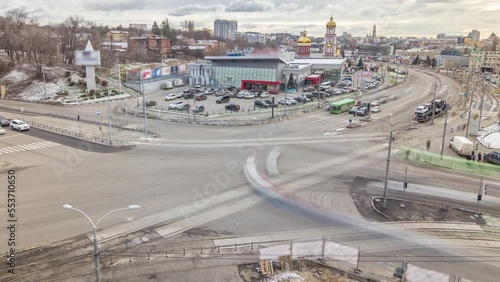 Traffic on the streets intersection of the city aerial timelapse in Kharkov, Ukraine. Klochkovskaya street and downhill in the downtown with tram railways after reconstruction photo