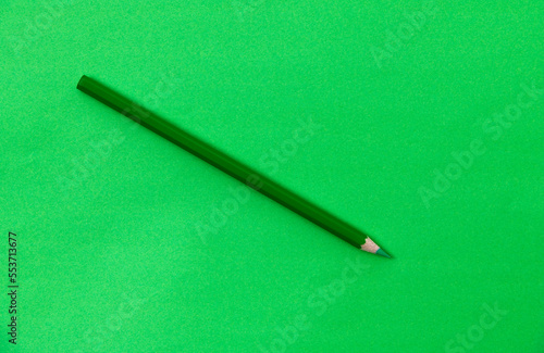 Green color pencil on green background