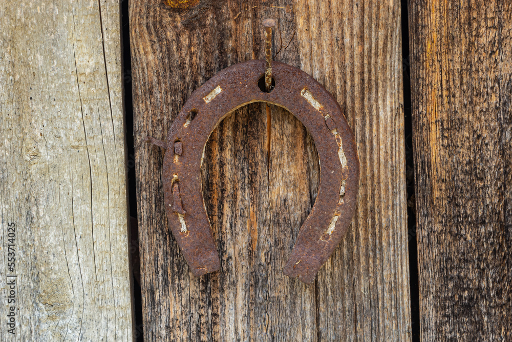 Wood texture background with rusted horseshoe, Old wooden board, background Wood texture background with rusted horseshoe, Old wooden board, background