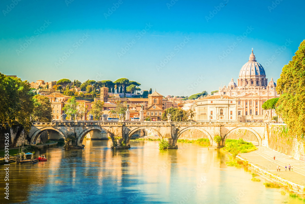 St. Peter's cathedral over bridge and river in Rome, Italy