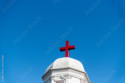 A red cross on the roof of church