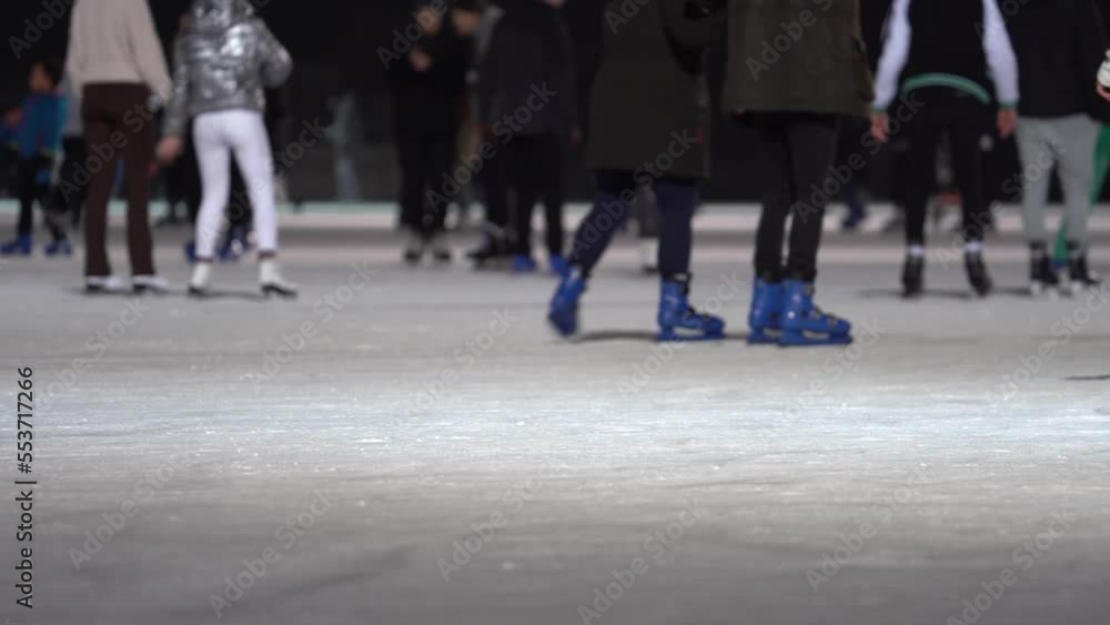 People, Holidays, Winter and Leisure Concept - Medium Shot, Legs On Skating Rink People, Holidays, Winter and Leisure Concept - Medium Shot, Legs On Skating Rink