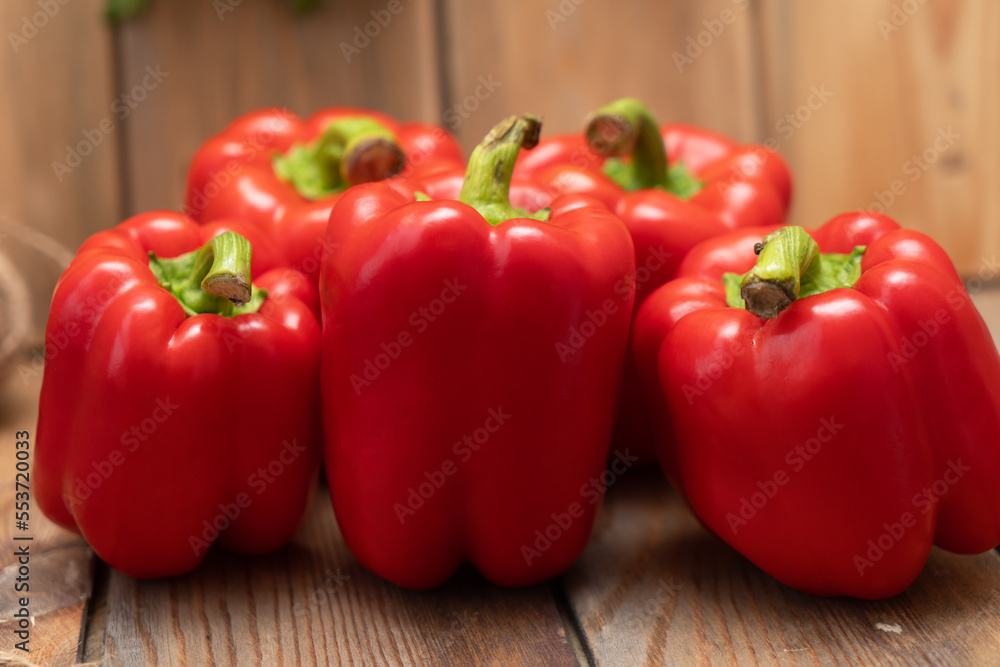 Red peppers on a wooden background Red peppers on a wooden background