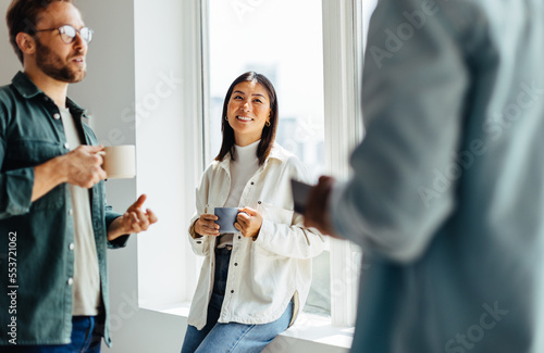 Young business professionals having a coffee break in an office