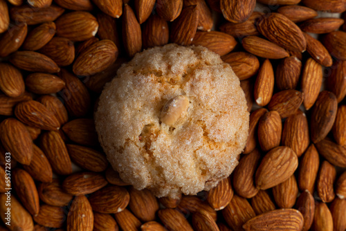 Top view of a pardulas biscuit with almond as a background photo