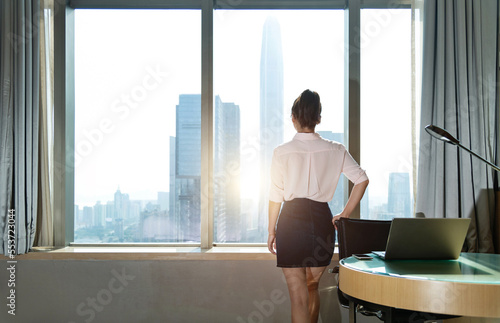 Businesswoman standing in front of the window Free Download Businesswoman standing in front of the window - GFXLoad