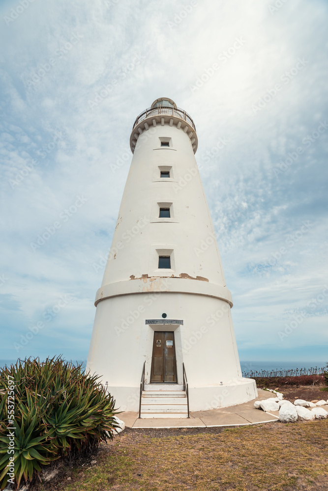 Cape Willoughby lighthouse viewed against blue sky with clouds on a day, Kangaroo Island, South Australia