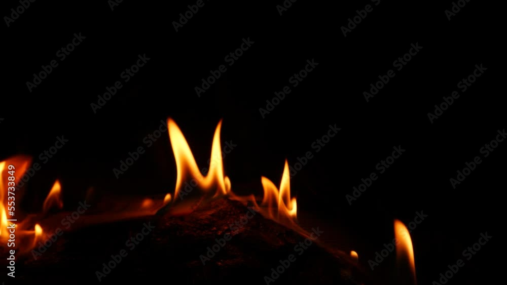 Fire burning in a round form,dark background yellow flames Fire burning in a round form,dark background yellow flames