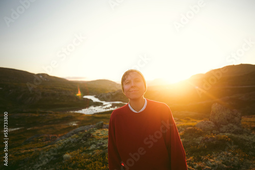 Smiling female hiker looking at camera