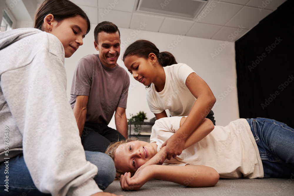 Teacher giving first aid training Teacher giving first aid training