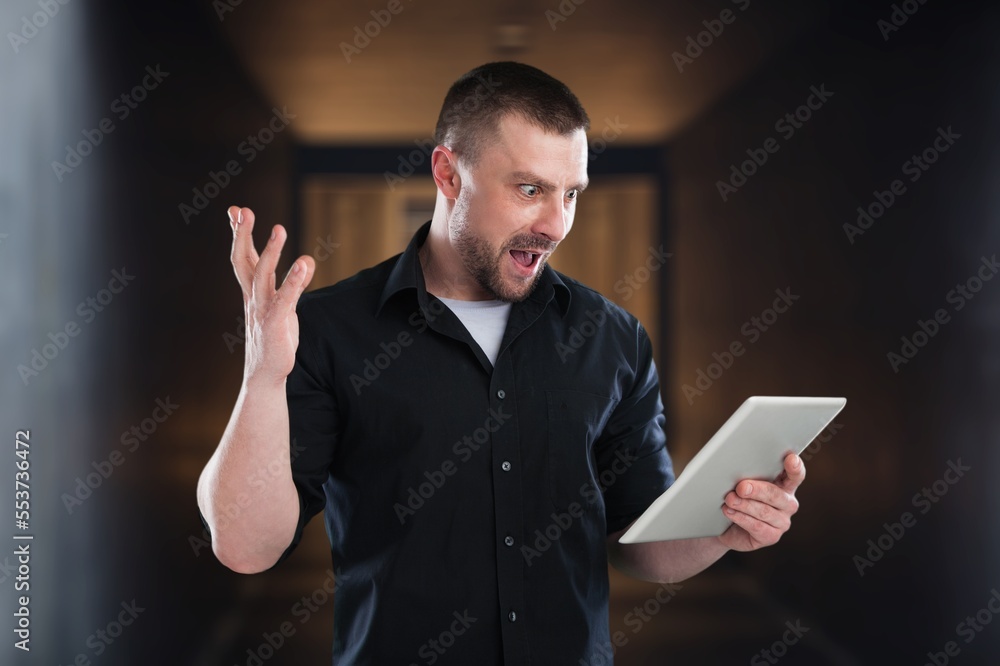 Rich business man standing outdoors and using phone Rich business man standing outdoors and using phone