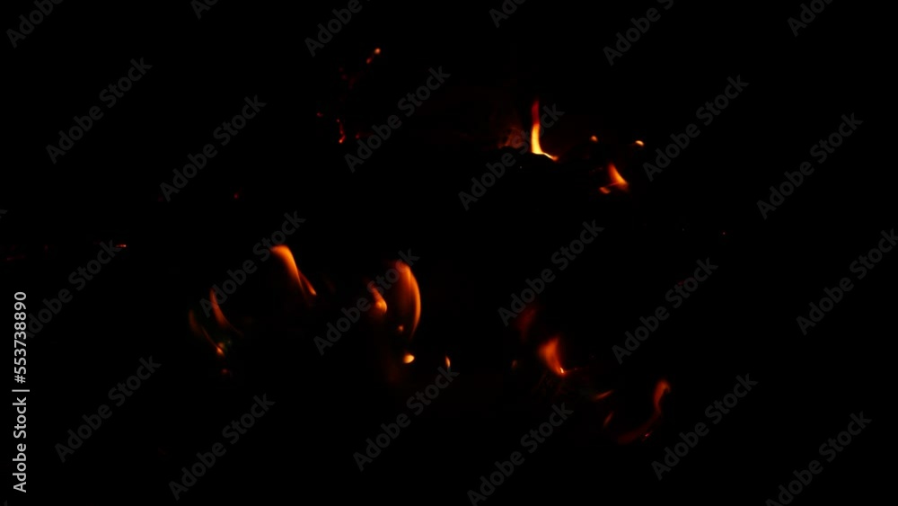 Fire burning slightly in darkness orange flame Fire burning slightly in darkness orange flame