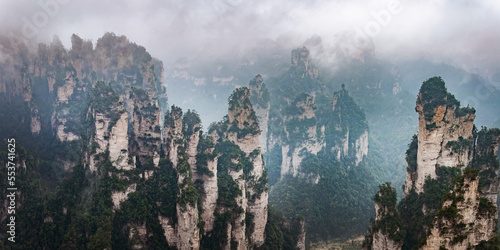 Misty steep mountain peaks in Zhangjiajie  China. Avatar floating mountains panorama.