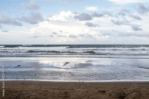 Cloudy day at the beach with no people. Touristic Tecolutla beach in Veracruz, Mexico. photo