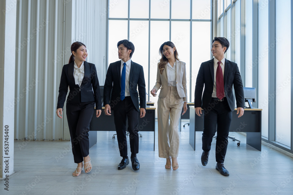 A group of young Asian businessmen Talking and planning work happily and have fun. at the company's office A group of young Asian businessmen Talking and planning work happily and have fun. at the company's office
