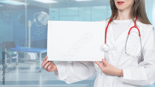 Woman doctor shows white sh...