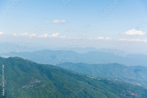 Aerial view of mountains covered with forests in summer