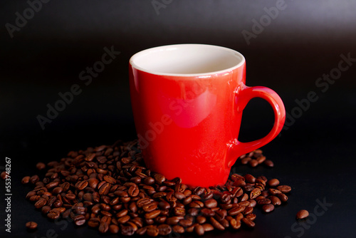 coffee beans in a cup on black background