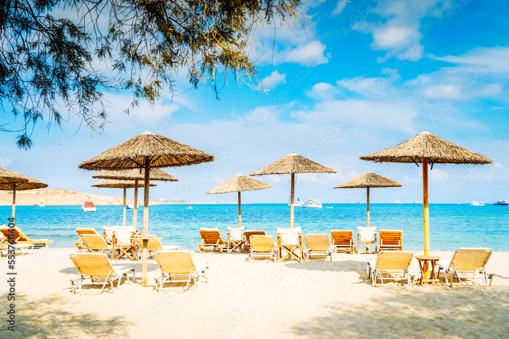 Romantic beach with sunbeds at greek island, Paros Greece, toned