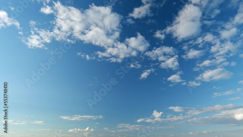 Clouds cumulus and cirrocumulus on different layers in tropical summer sunshine day. Timelapse. photo