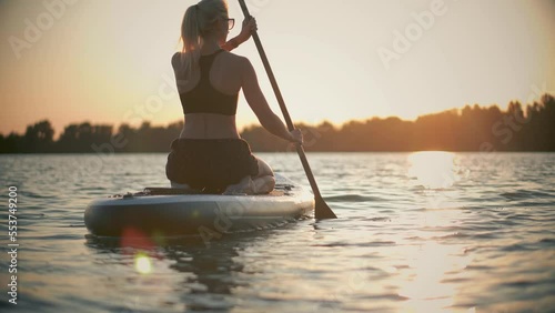 sup board water tourism. paddling on sup paddleboard photo
