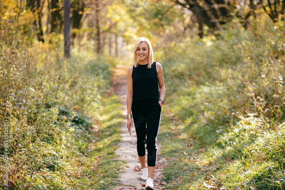 young girl walking in autumn park young girl walking in autumn park