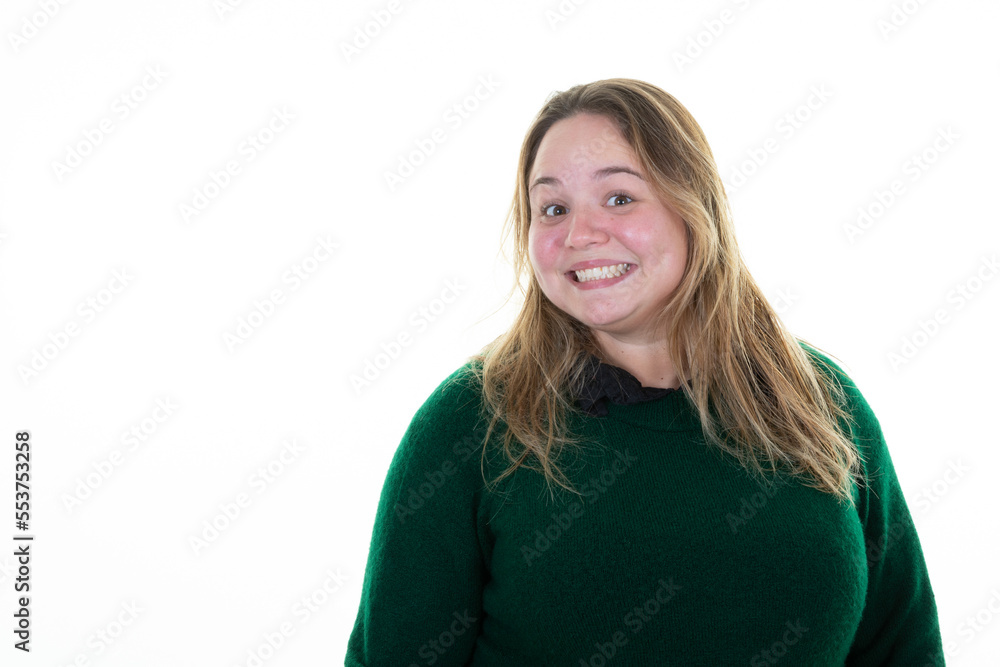 plus size positive smiling woman with big breasts face girl happy on white  background in green sweater Stock Photo