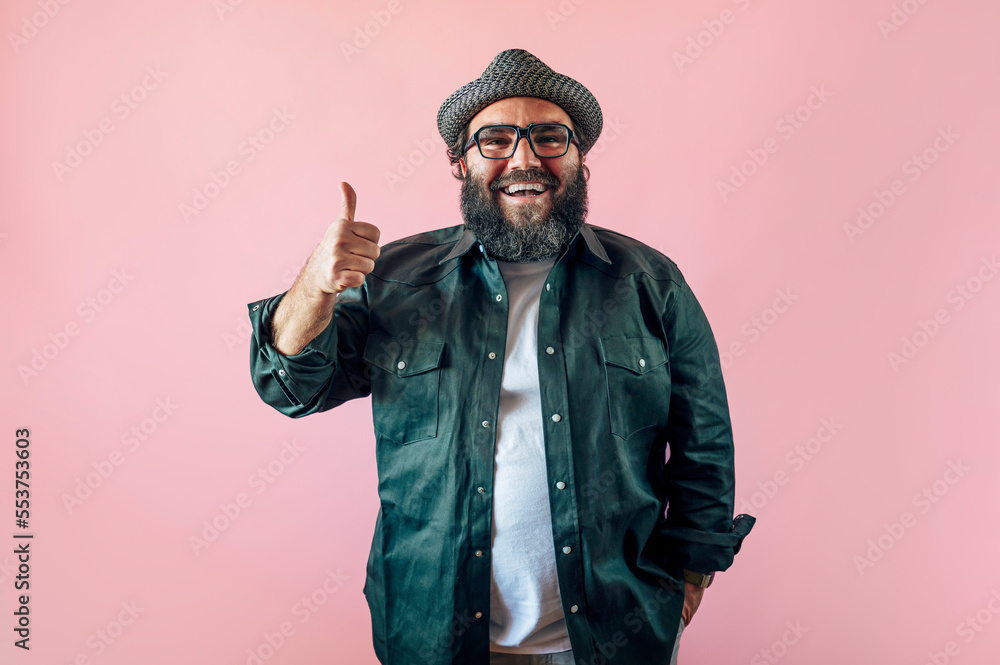Fat man with a beard and doing the up sign. Fat man with a beard and doing the up sign.