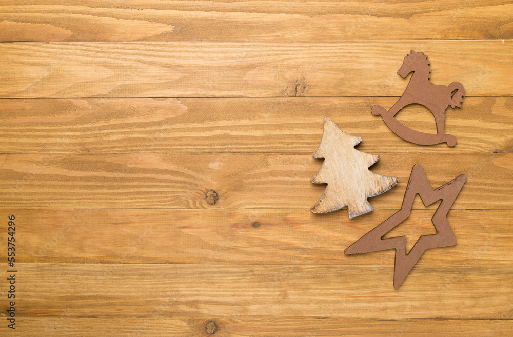 Wooden Christmas toys on wooden background, top view Wooden Christmas toys on wooden background, top view