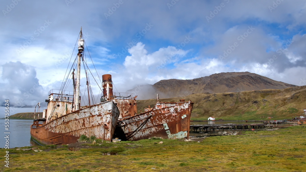 Old, rusted whaling and sealing ships beached in the harbor, at the old whaling station at Grytviken, South Georgia Island