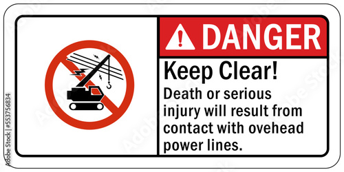 Overhead power lines sign and labels keep clear