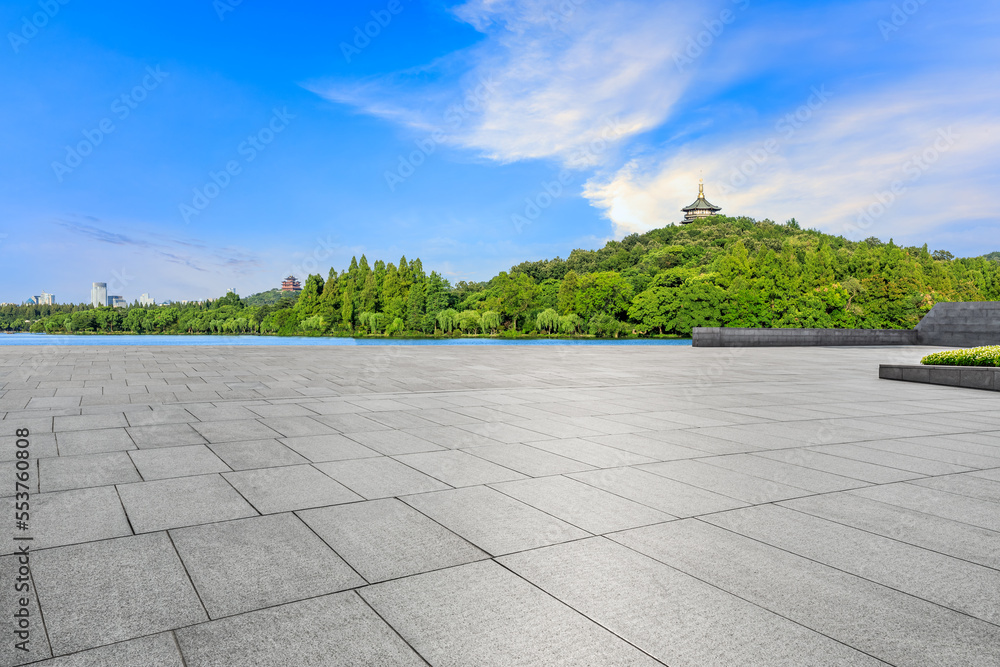 Empty square floor and green mountain natural scenery in Hangzhou, China.