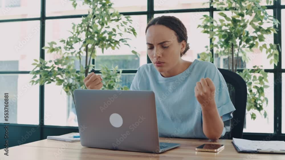 Annoyed angry young brazilian or latino business lady, company director, supervisor, annoyed looks at laptop screen, sits in office, gesturing with hands, irritated by poor performance of employees Annoyed angry young brazilian or latino business lady, company director, supervisor, annoyed looks at laptop screen, sits in office, gesturing with hands, irritated by poor performance of employees