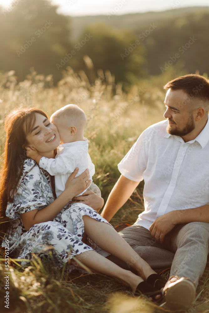 Fototapeta premium Happy young family spend time together outside in green nature