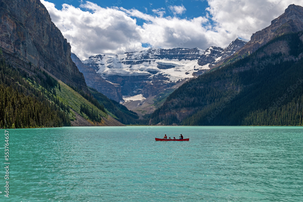 Lake Louise and Victoria glacier with unrecognizable people on kayak, Banff national park, Alberta, Canada. Lake Louise and Victoria glacier with unrecognizable people on kayak, Banff national park, Alberta, Canada.
