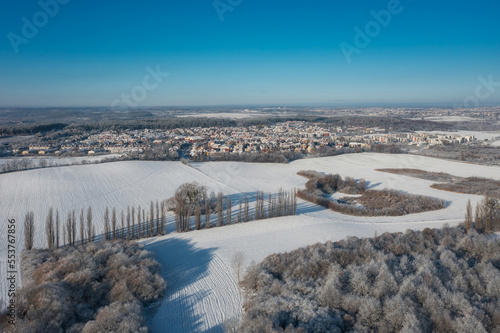 Aerial landscape of the meadow covered with fresh snow, Poland