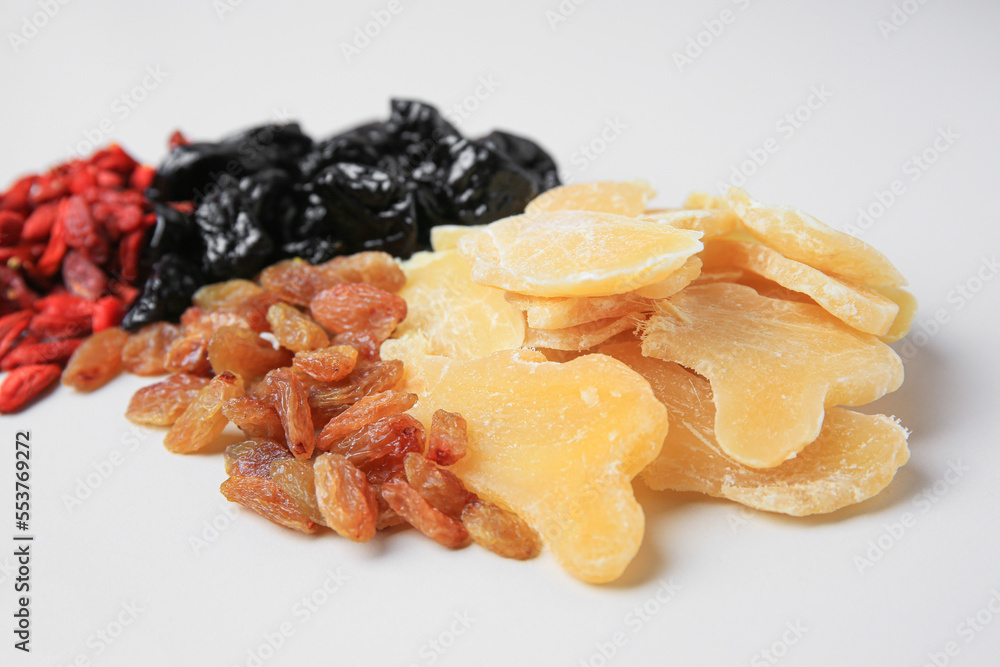 Pile of different dried fruits on white background, closeup Pile of different dried fruits on white background, closeup