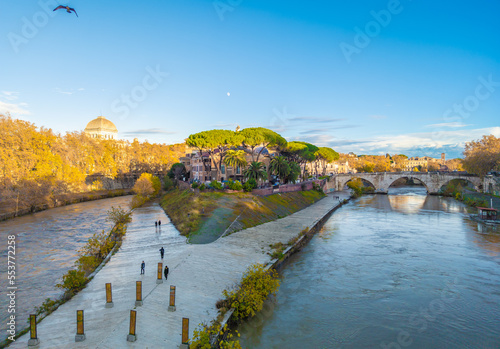 Rome (Italy) - The Tiber river and the monumental Lungotevere street in the metropolitan capital of Italy. Here in particular the Isola Tiberina island. photo