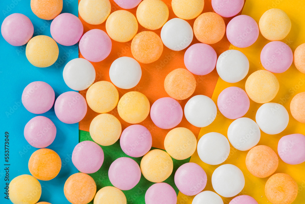 Candy on the colorful background, high angle view Candy on the colorful background, high angle view
