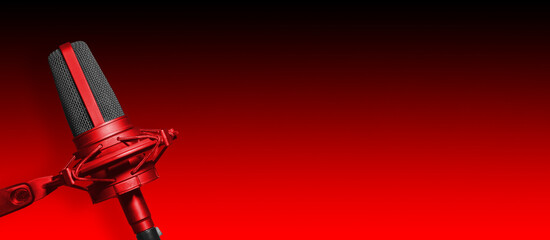 Recording studio microphone on red background with copy space for podcast or radio broadcast website banner